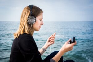 person listening to headphones